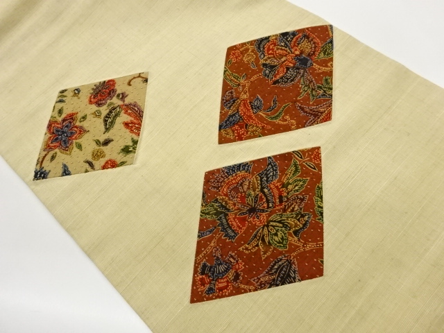 手織り紬切り嵌め相良刺繍菱に草花模様織出し名古屋帯